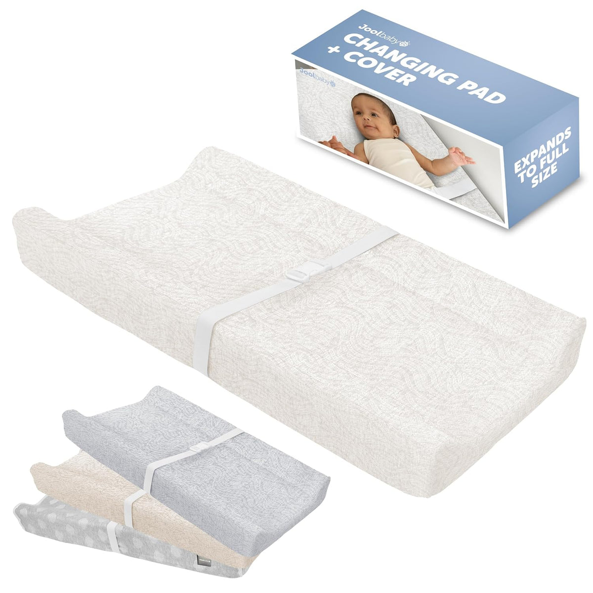 Ivory contoured baby changing pad with textured cover and strap, plus smaller stacked covers below