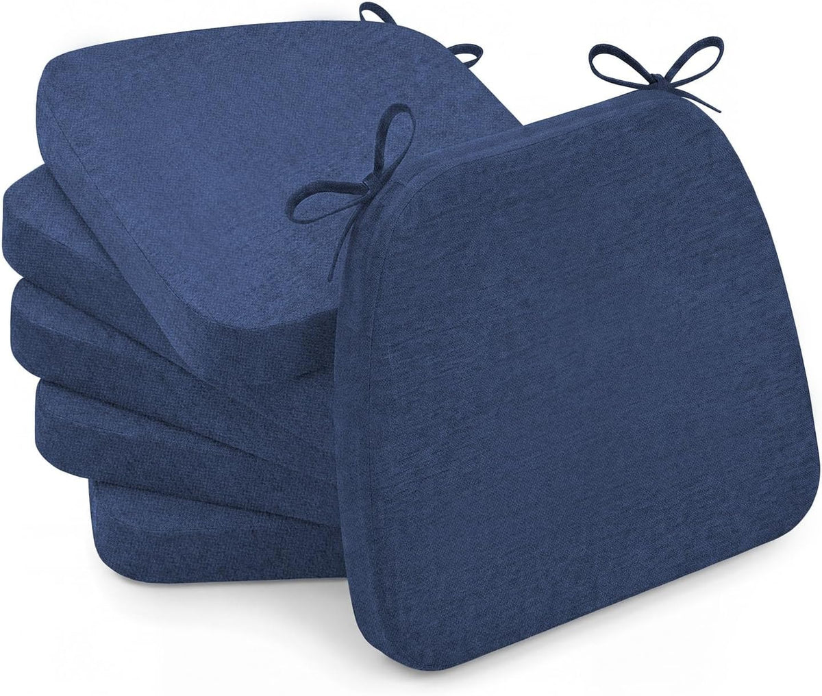 Stack of four navy D-shaped chair cushions with one propped forward, tied loops visible at the top.