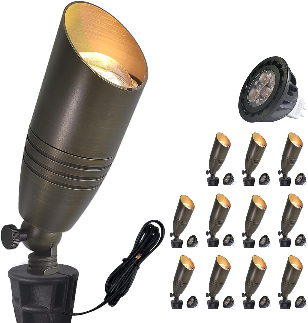 Bronze outdoor spotlight angled upward showing gold-toned interior, coiled cable and a separate MR16 bulb, several small