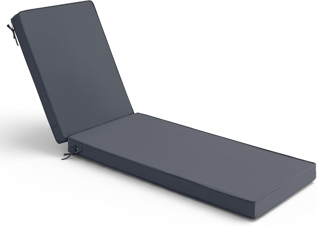Side-angle view of a dark charcoal chaise lounge cushion with tied straps and two-panel backrest.