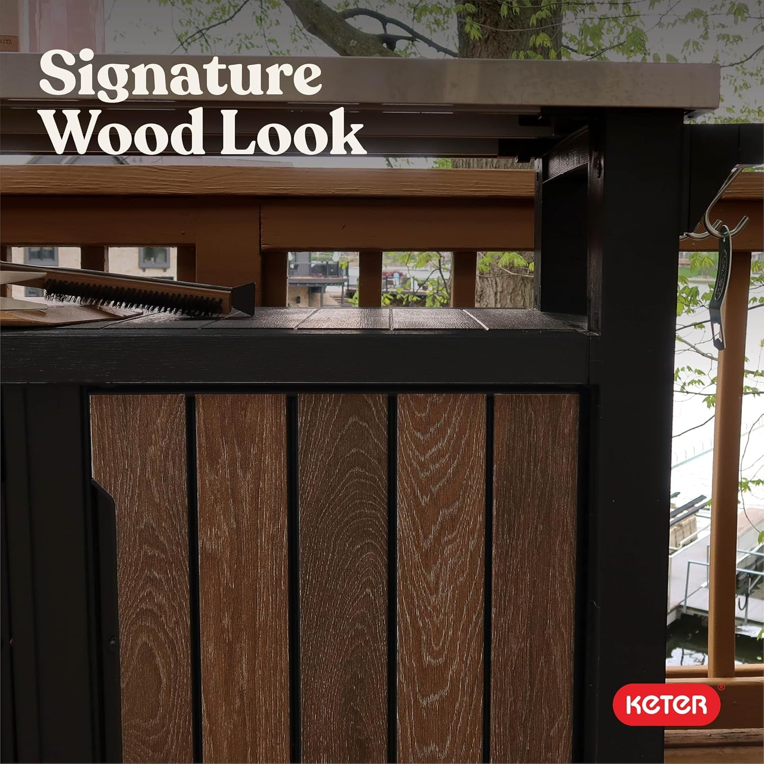 Close-up of vertical wood‑grain slatted panel and stainless top edge on an outdoor railing