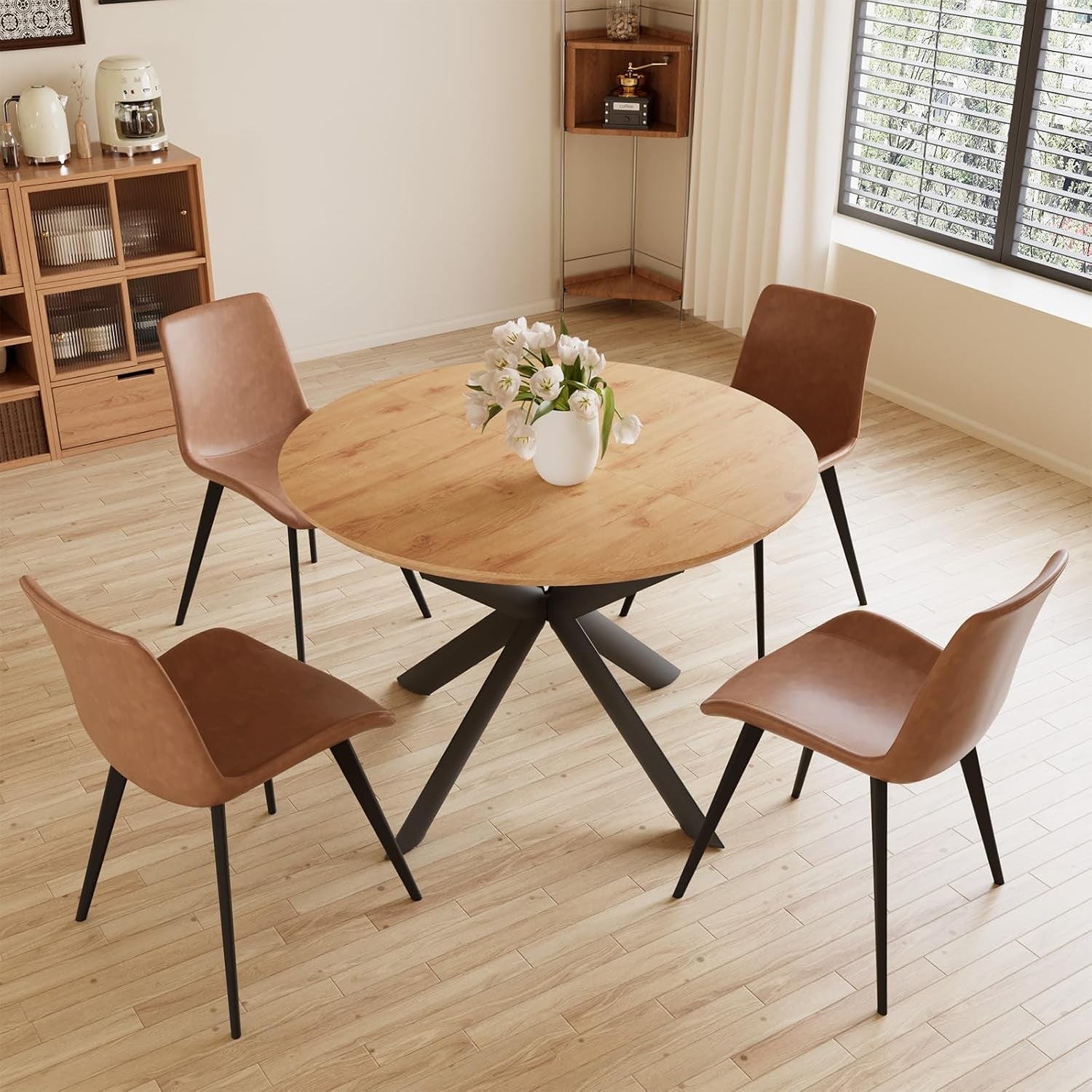 Top-down view of oak woodgrain round dining table with four brown PU chairs in a bright dining room setting