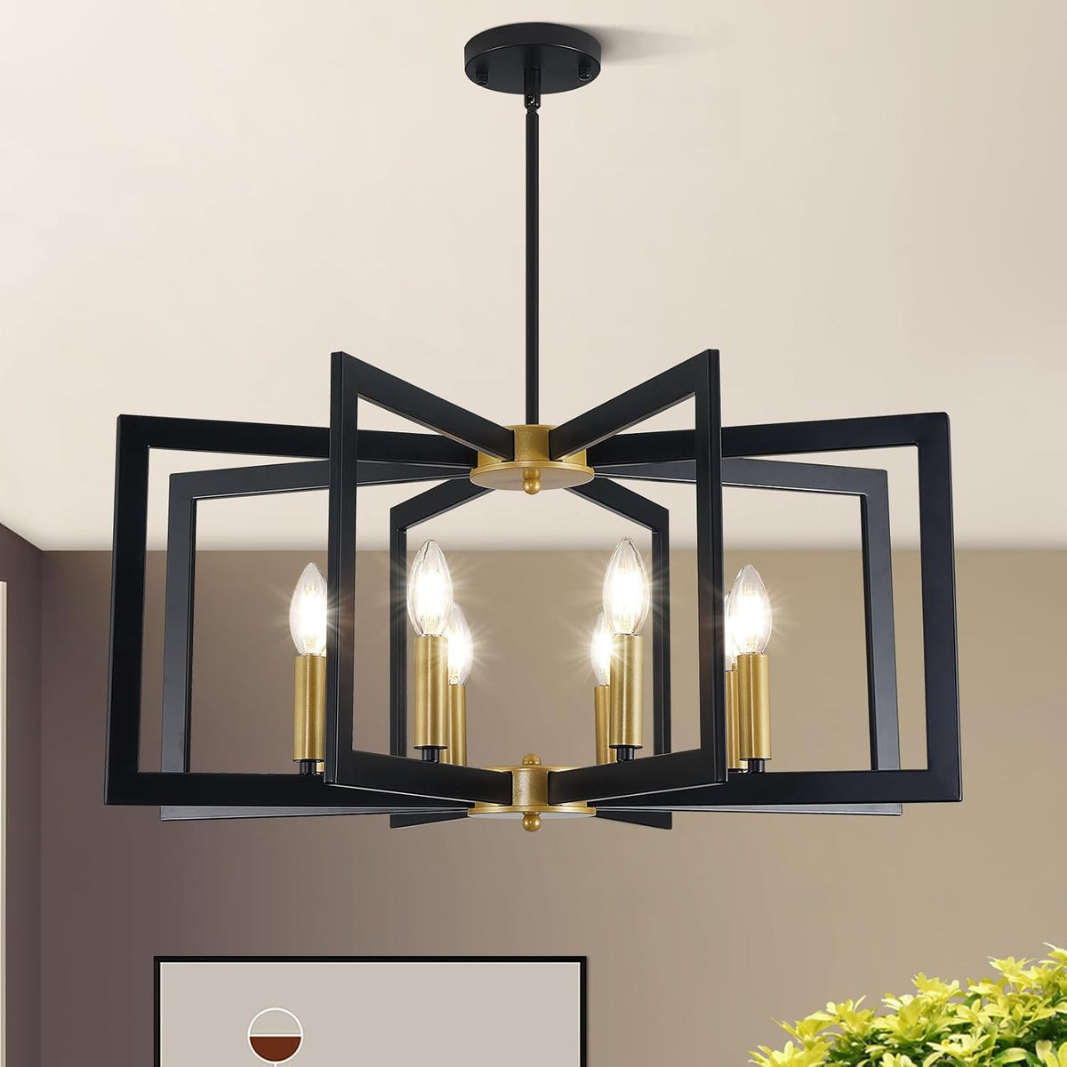 Front view of a six-light black and gold geometric chandelier suspended from the ceiling with lit candle-style bulbs.