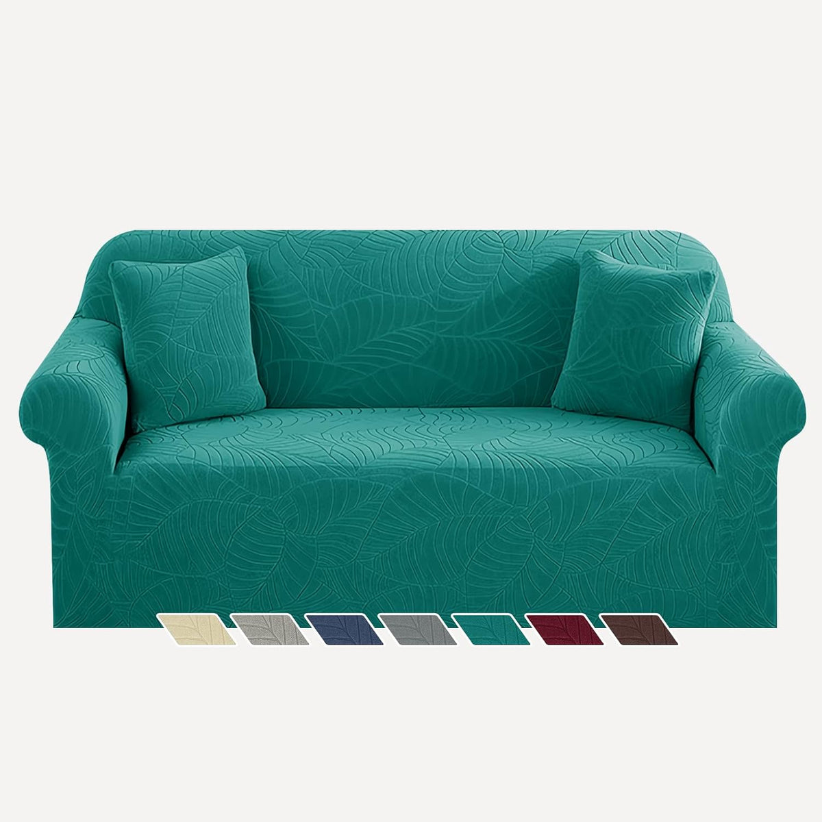 Front view of teal jacquard sofa cover fitted on a three-seat sofa with two matching pillows