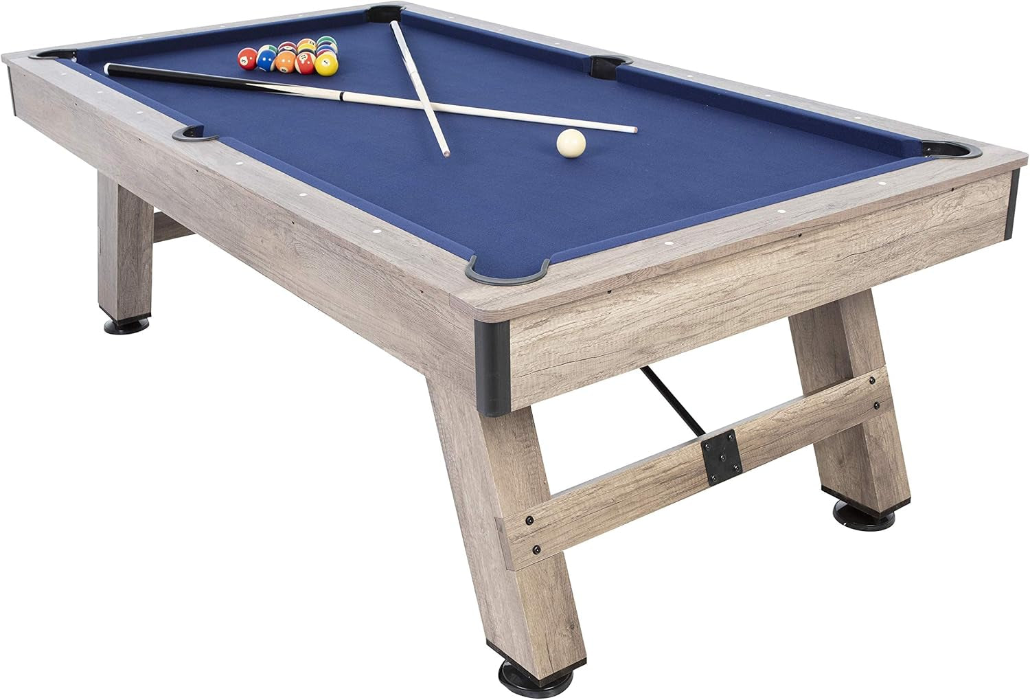Angled view of a rustic wood pool table with blue felt, crossed cues, and sturdy A-frame legs