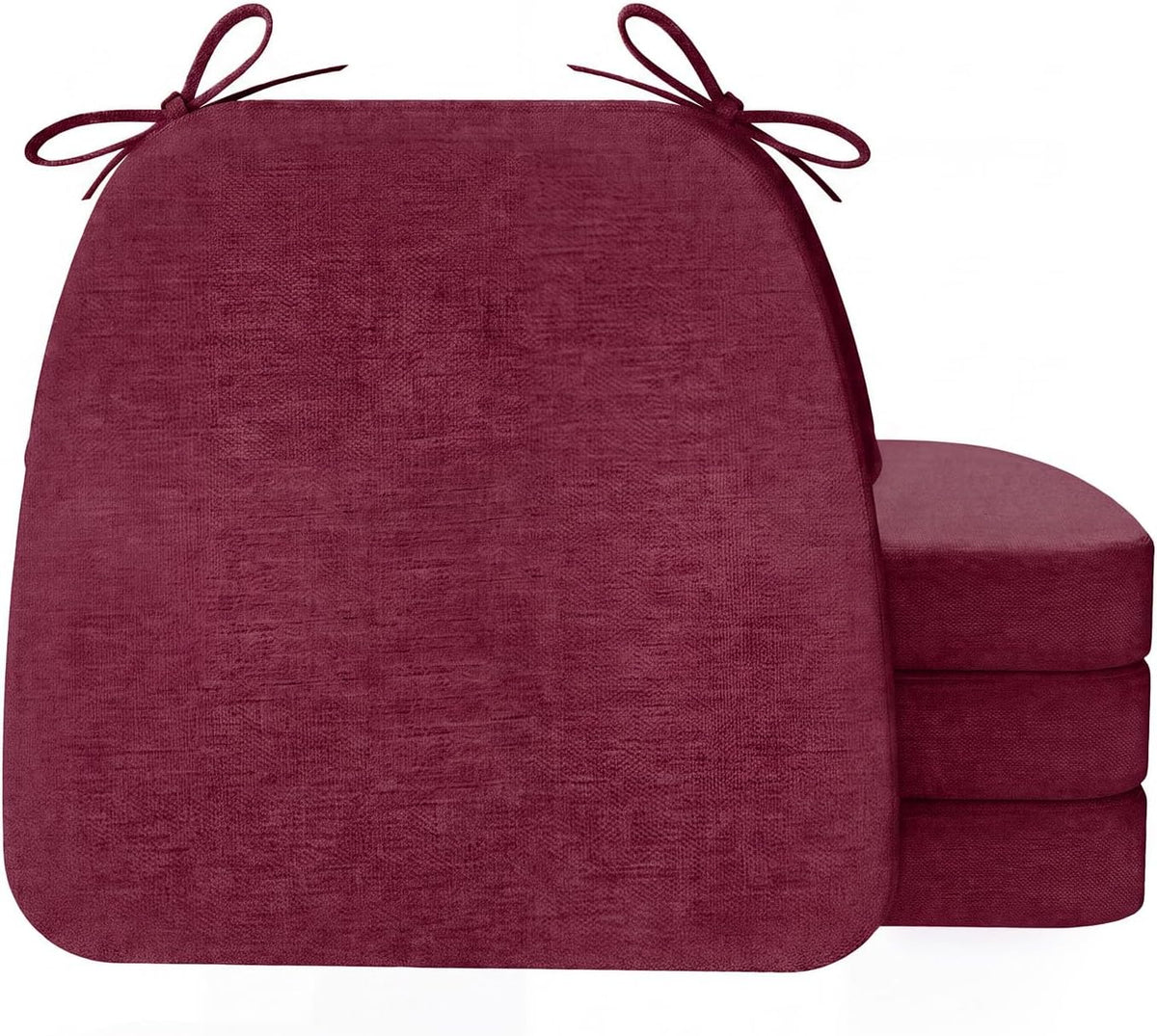 Front view of a deep burgundy D-shaped cushion with three matching cushions stacked behind to the right.