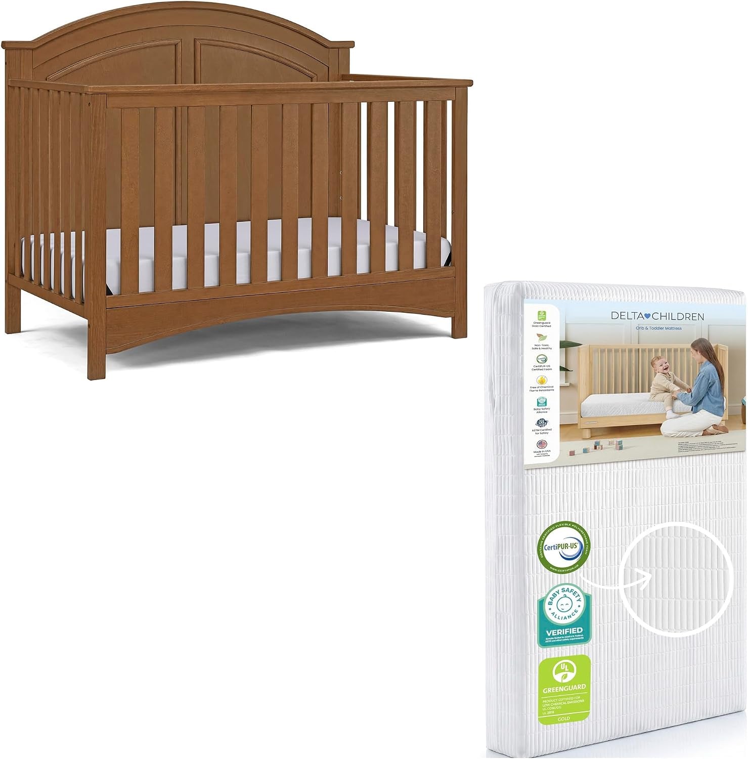 Three-quarter view of a light brown crib paired with a packaged white mattress shown beside it.