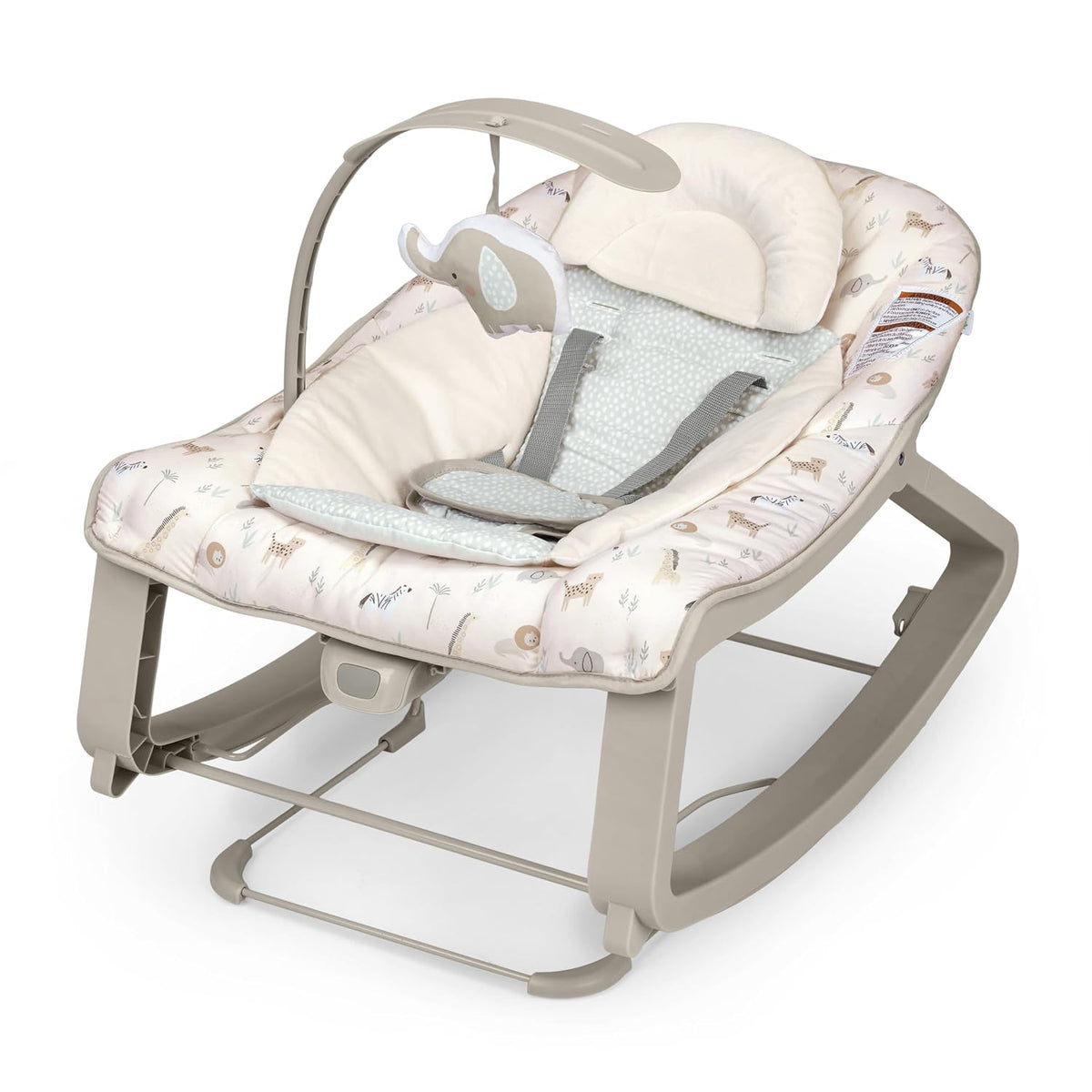 Close three-quarter view of a beige animal-print baby bouncer with removable bolster and hanging elephant toy.