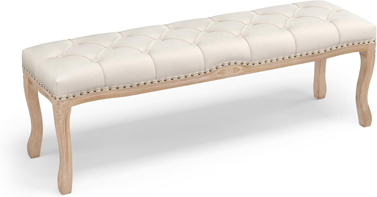Full-length side view of the bench in ivory upholstery showing scalloped apron and curved wooden legs