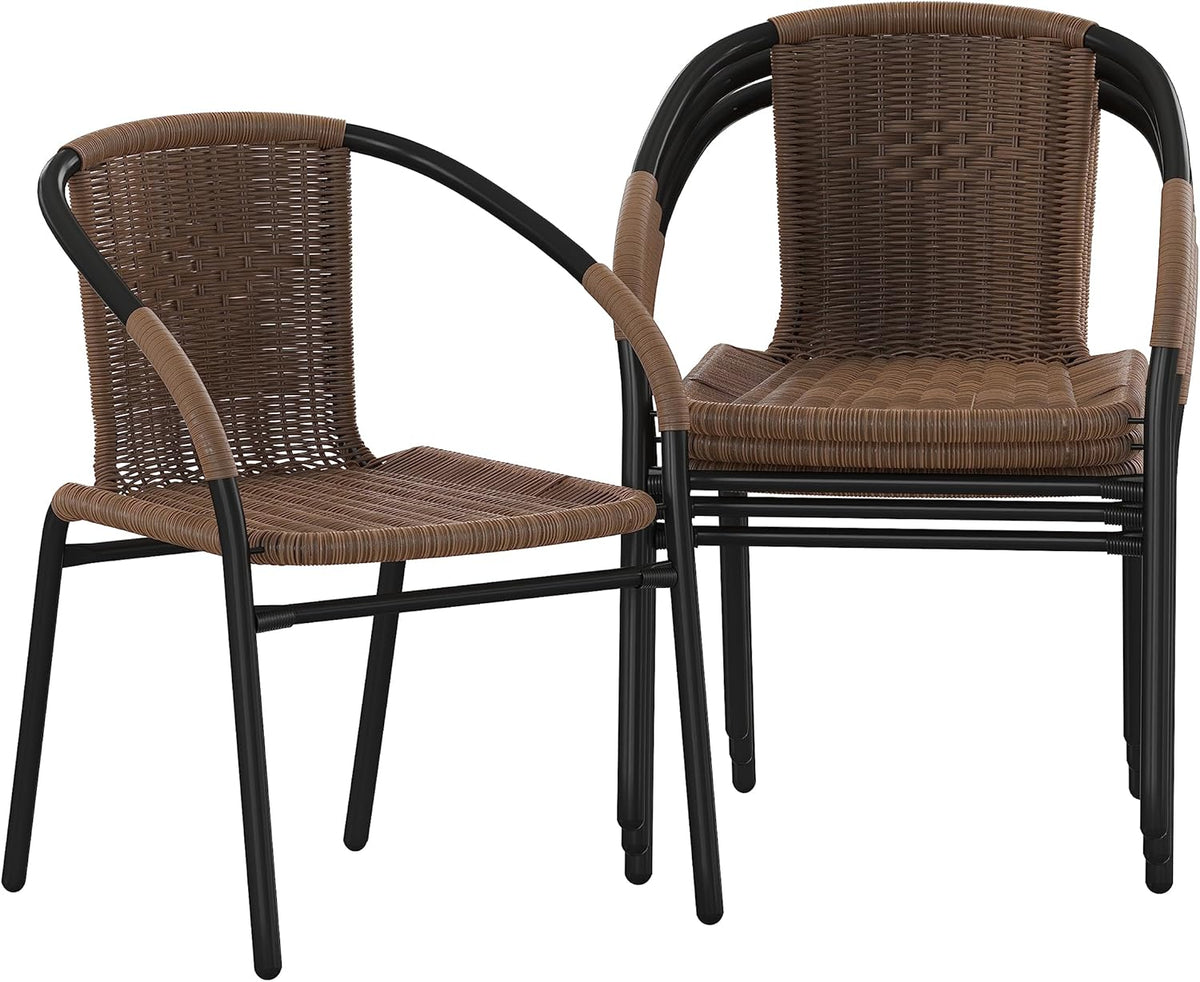 Pair of brown rattan chairs with black frames, one slightly stacked on the other to show stacking feature.