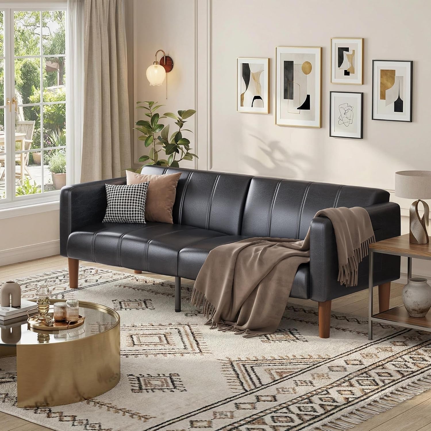 Black convertible futon styled in a living room setting with throw blanket and pillows