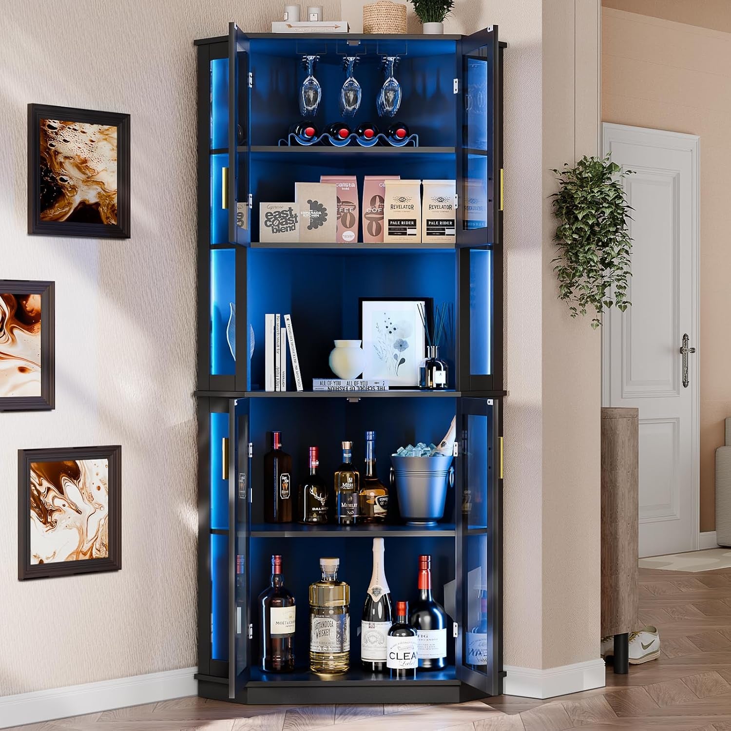 Black corner wine bar cabinet with glass doors and blue interior LED lighting, filled with bottles and decor.