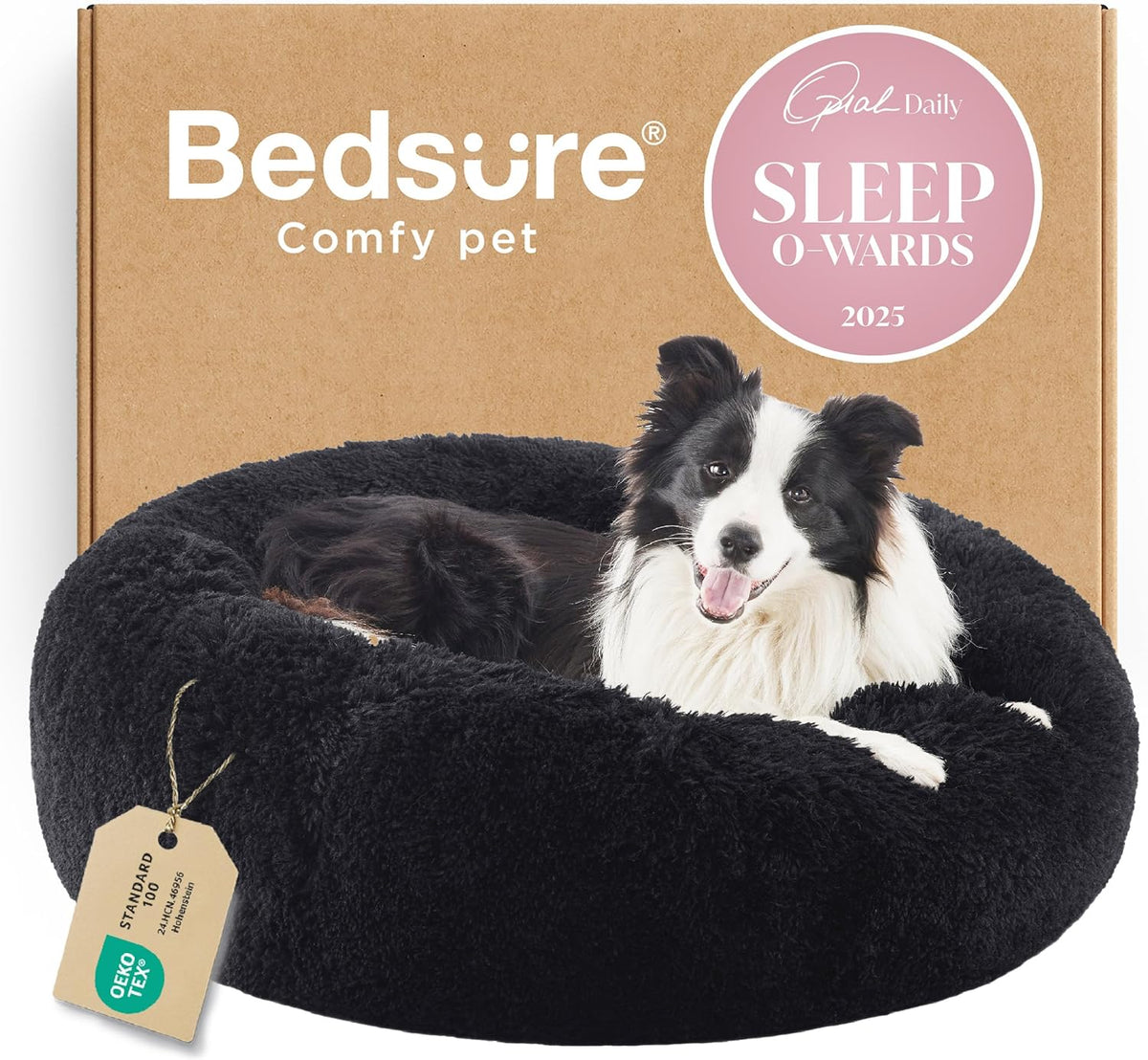 Front-facing view of a black fluffy round bed with a smiling black-and-white dog propped on the rim.