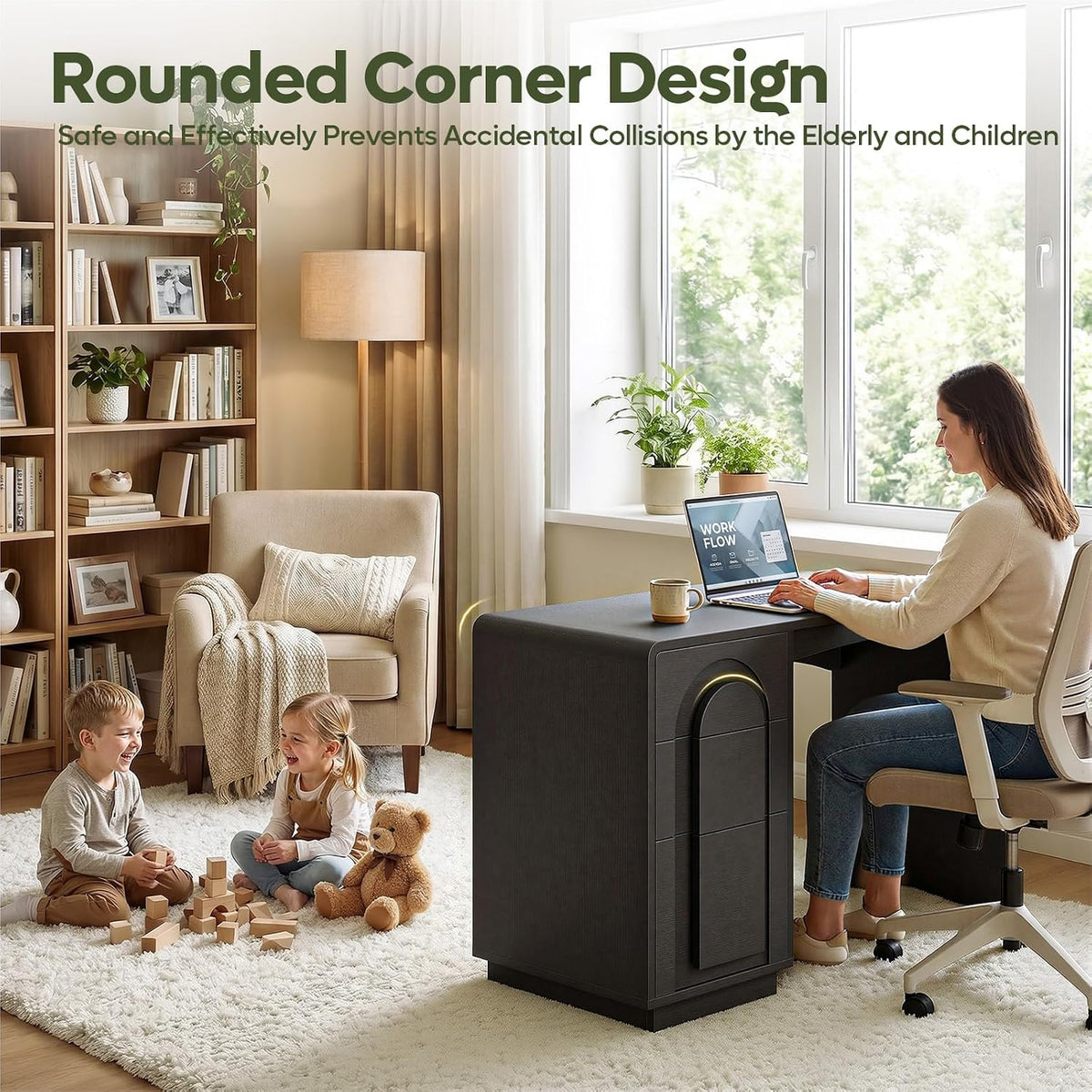 Black desk in lifestyle scene with person seated using a laptop beside children playing highlighting rounded corner design