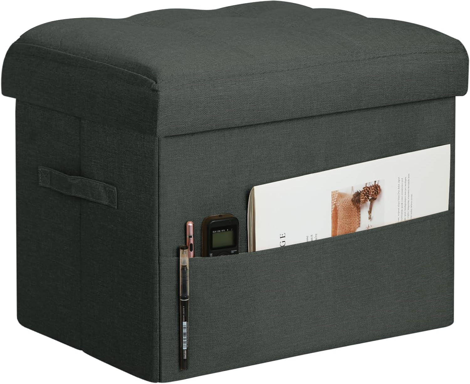 Dark gray linen-look storage ottoman at an angle with side pocket holding pens and a magazine.