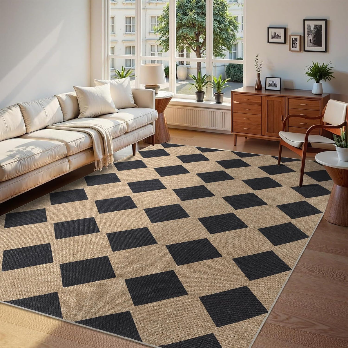 Living room view with a large neutral rug featuring a bold black square checker pattern.