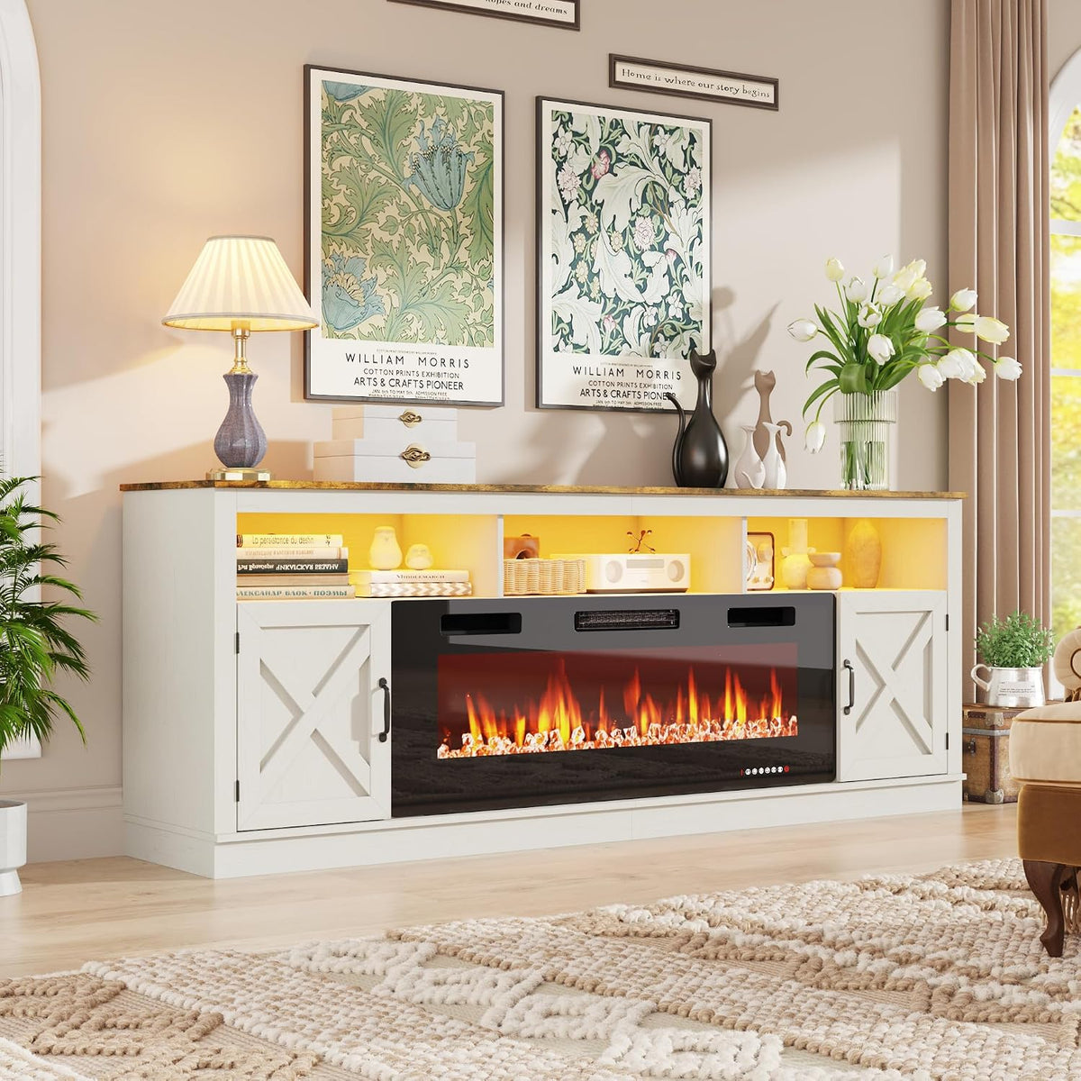 White farmhouse console with gold-accent top, patterned wall art above and sculptural cat figurines on the surface.