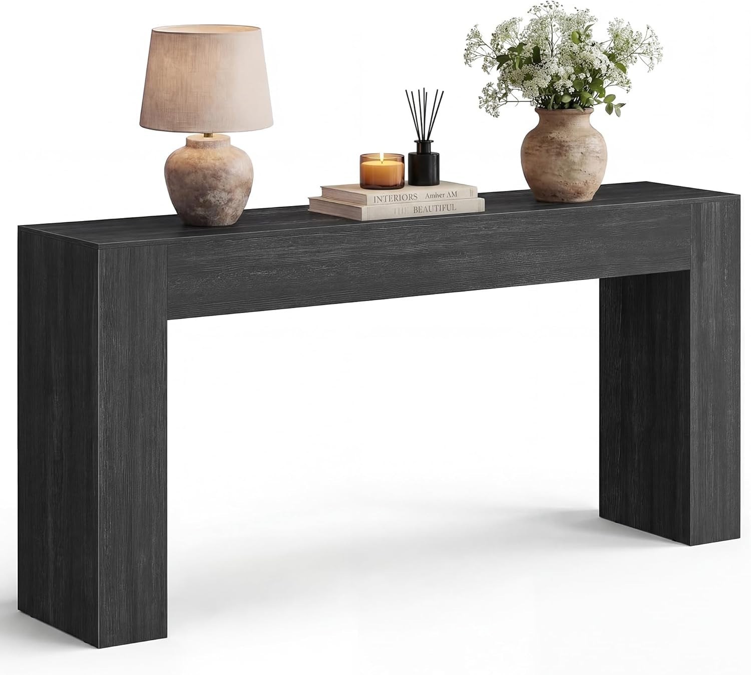 Front view of the console in a dark charcoal wood finish with decorative lamp and vase.