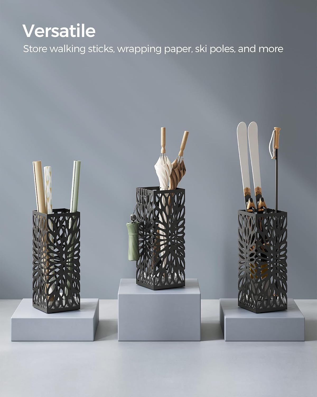 Three decorative umbrella stands on pedestals showing uses: holding wrapping paper, umbrellas, and skis