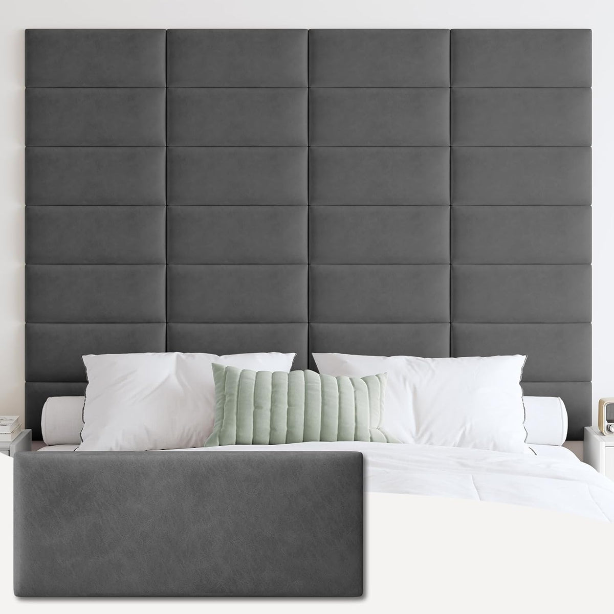 Tall grid of tufted rectangular panels in a medium slate-gray fabric behind a bed with white pillows and a mint-green lumbar