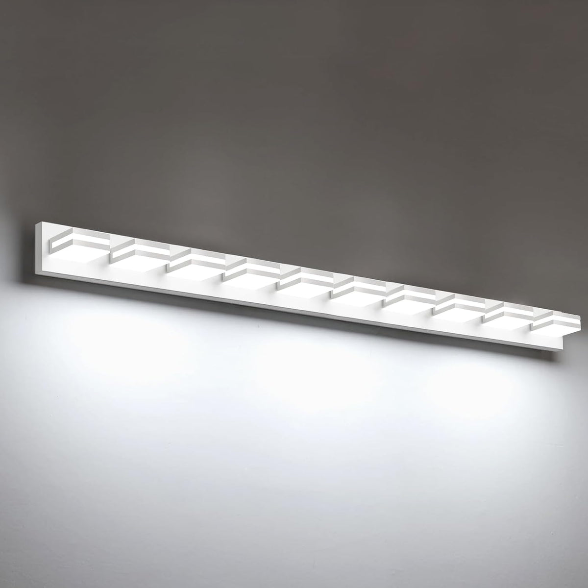 Long straight view of a white LED vanity bar showing eight small square light sections.