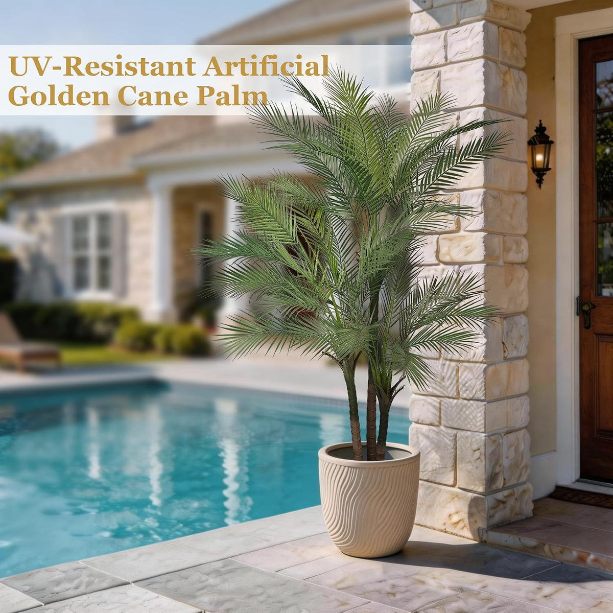 Artificial palm tree beside a pool in a beige textured planter on a patio