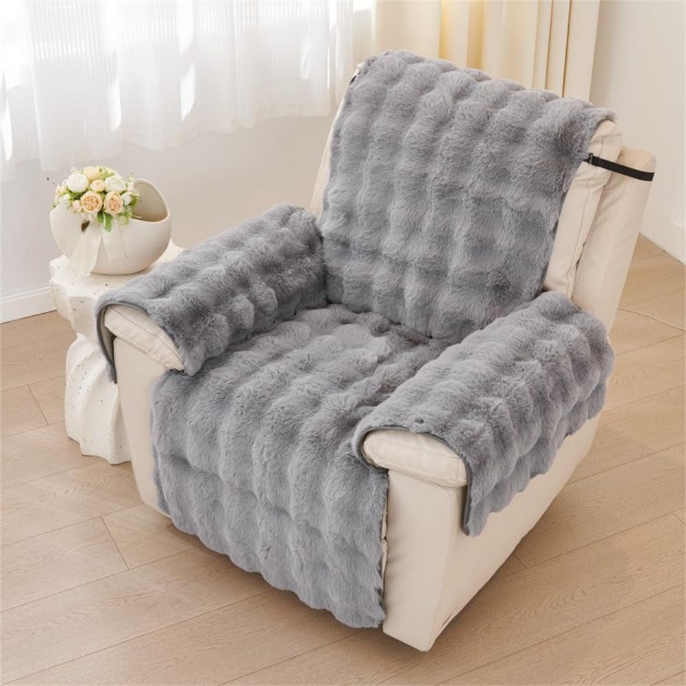 Grey faux rabbit fur slipcover fitted over a recliner with arm covers and back strap visible.