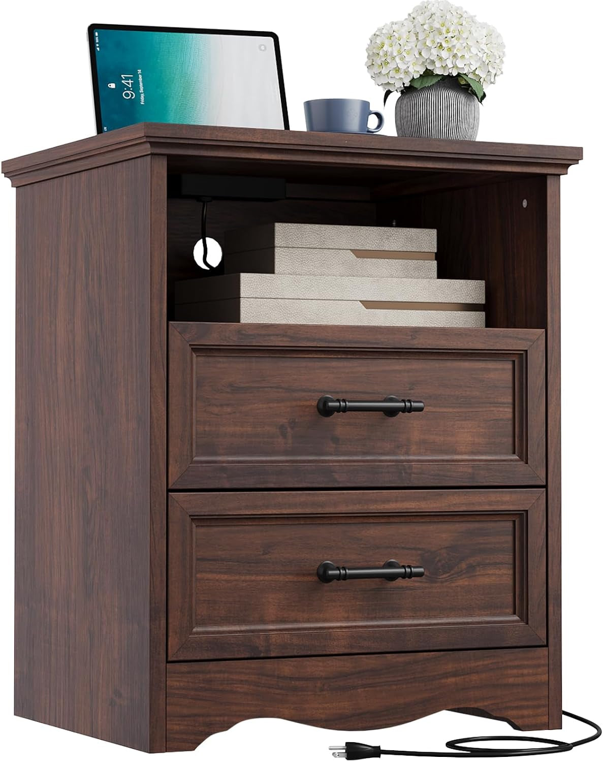 Front view of a dark brown wood nightstand with open cubby, two drawers, charger cord visible.