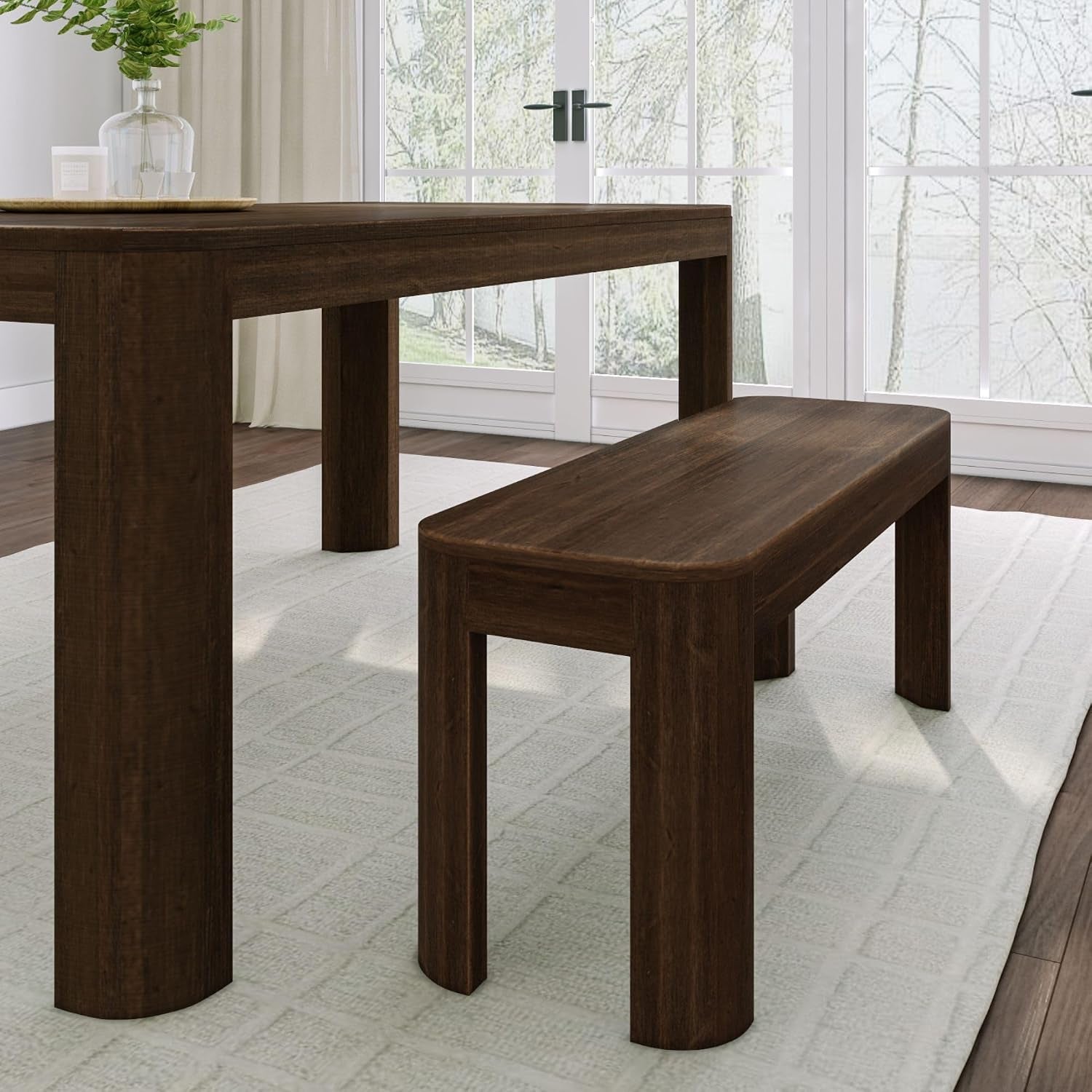 Walnut table paired with matching bench showing bench length that corresponds to the table