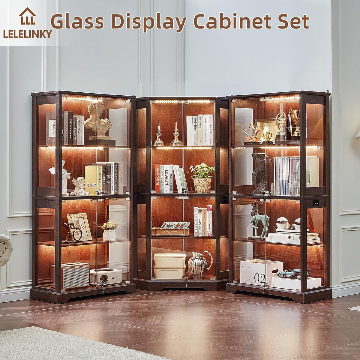 Three walnut-finish glass display cabinets arranged in a corner, lit and filled with decor