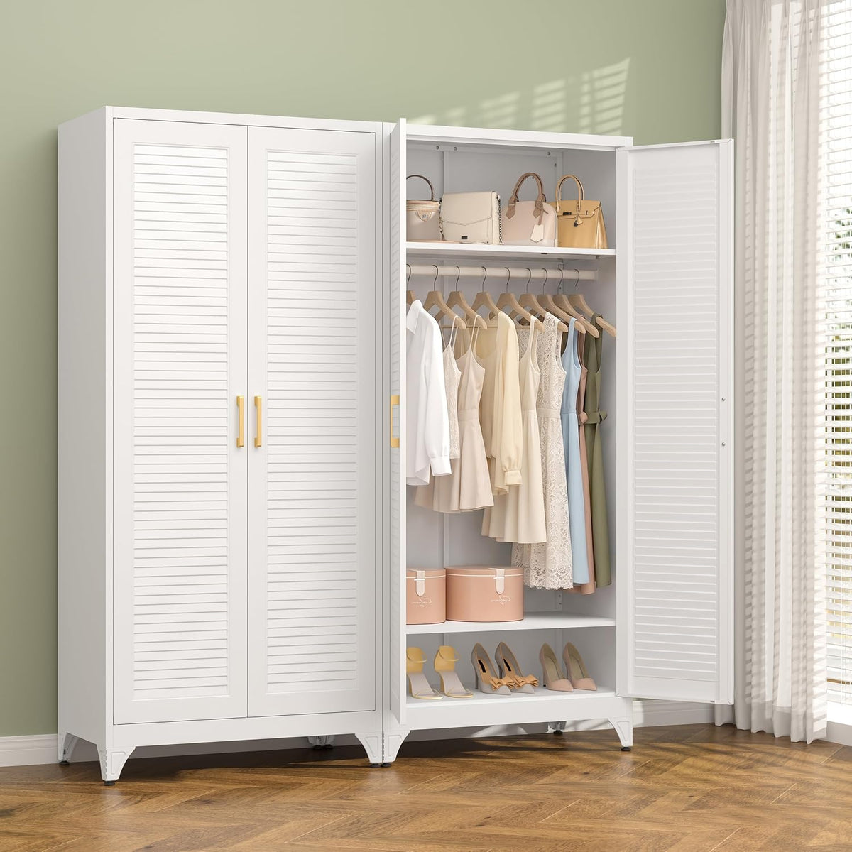 White version of the same wardrobe with doors open, showing hanging clothes, hat boxes and shoes inside.