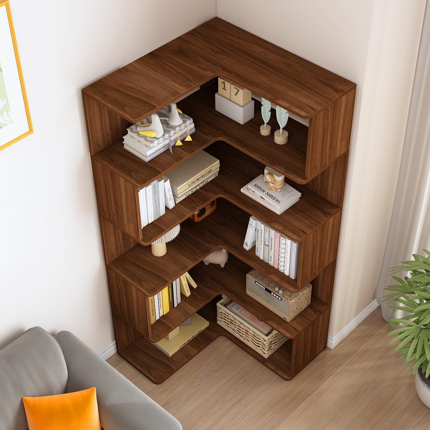 Overhead angled view of walnut L-shaped corner bookshelf showing staggered shelves and decor