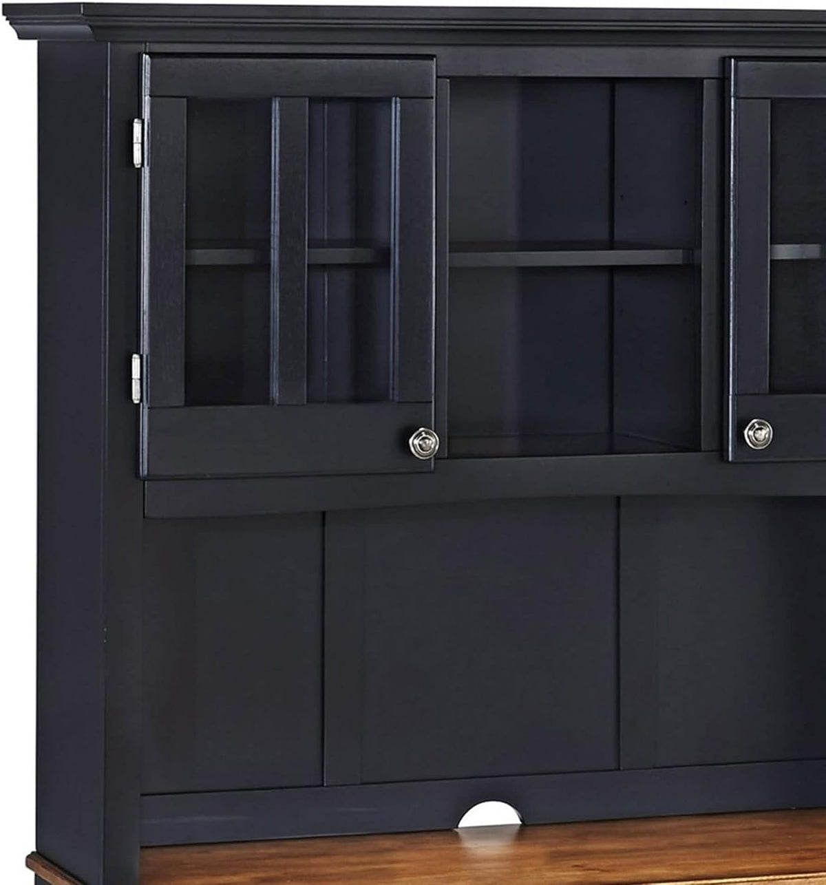 Close-up of the upper hutch showing two glass-front doors, interior shelf and cord access hole above the wood top.