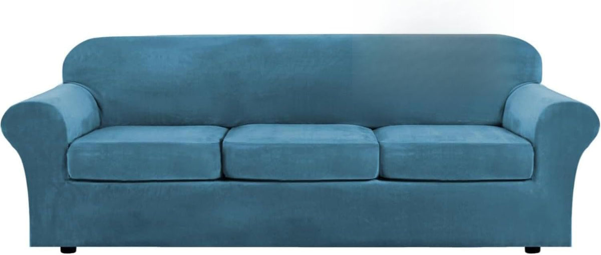 Front-facing medium blue three-seat sofa shown with the right half brightly lit and the left half in softer light.