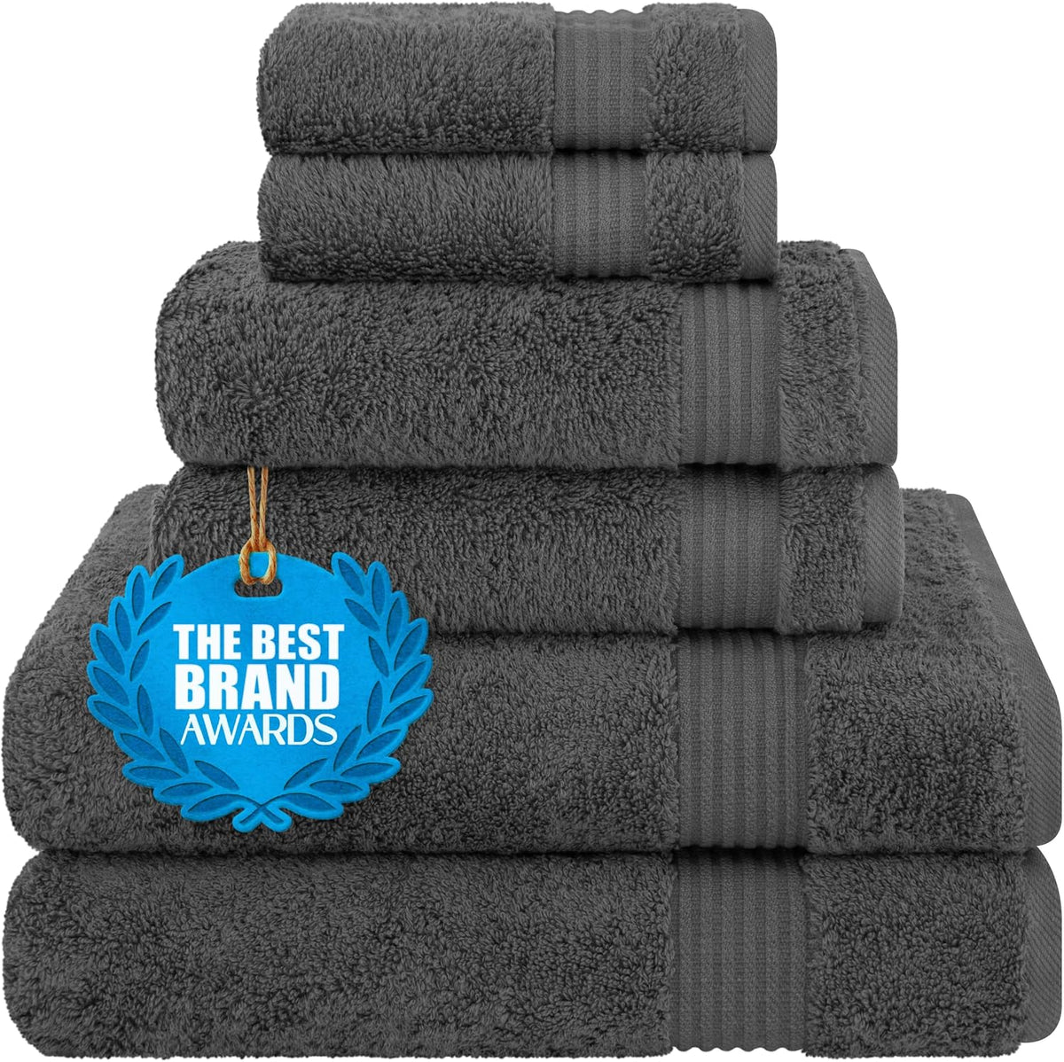 Neatly stacked dark gray towels with a blue award tag hanging on the front.