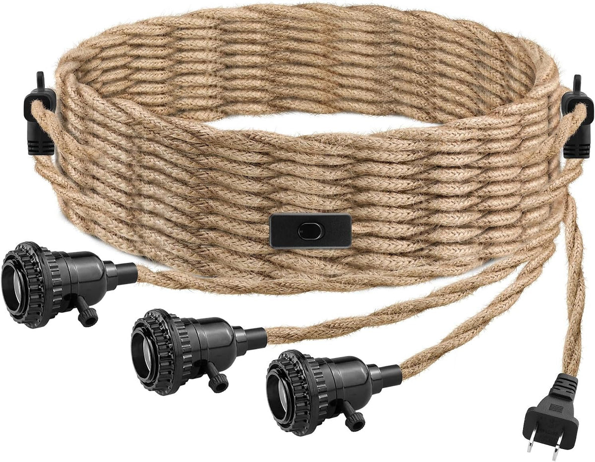 Close-up of coiled hemp rope cord with three black lamp sockets and plug on a white background