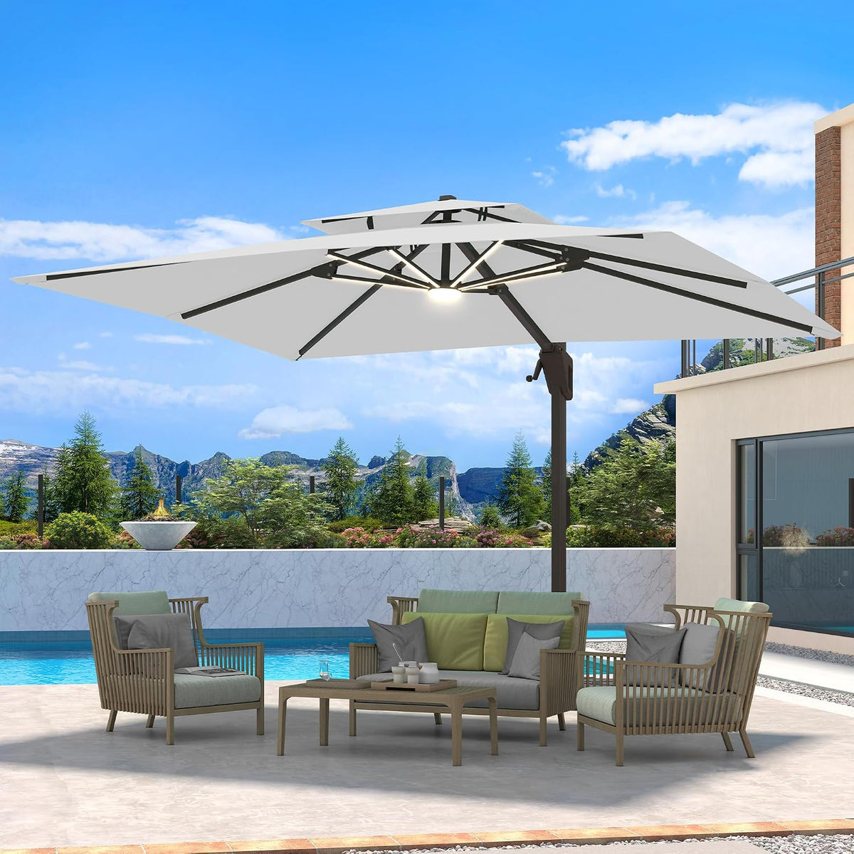 Poolside sofa and chairs shaded by a white offset umbrella showing internal ribs and light.