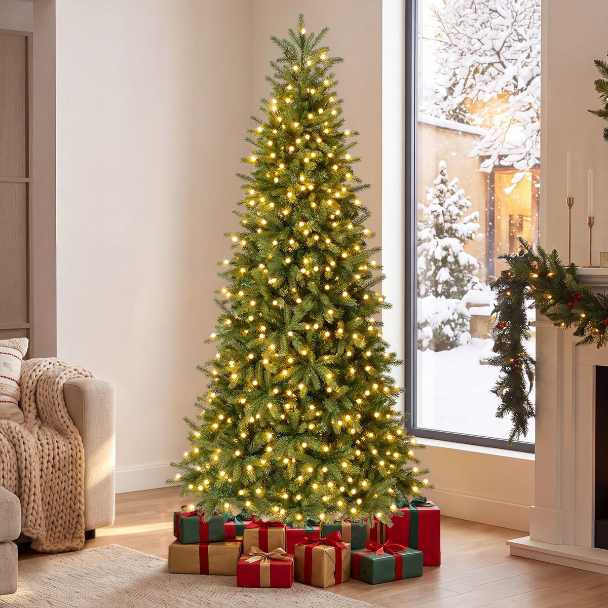 A glowing artificial tree stands beside a snowy window, with wrapped presents arranged around its base.