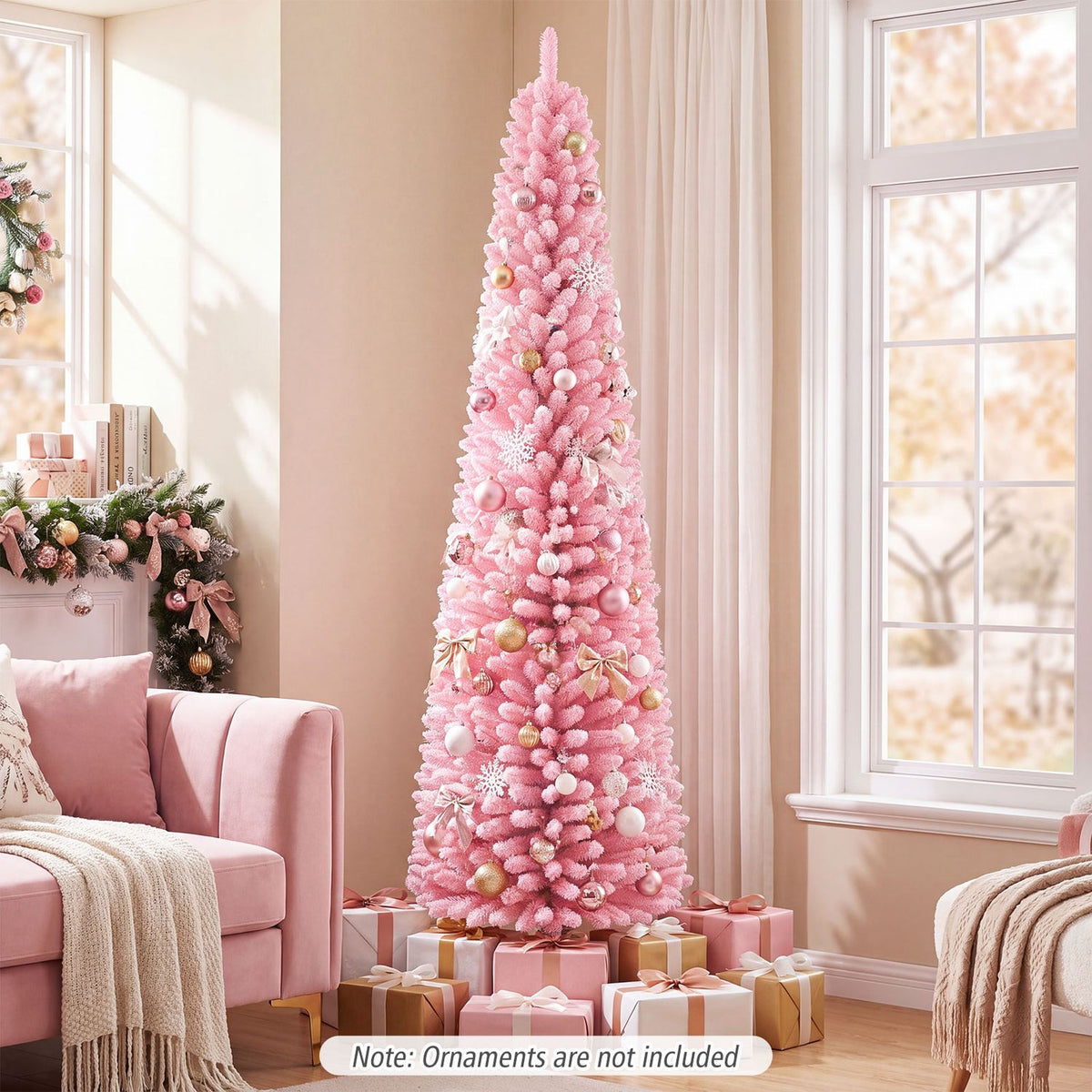Decorated pink flocked Christmas tree beside a pink sofa in a bright living room