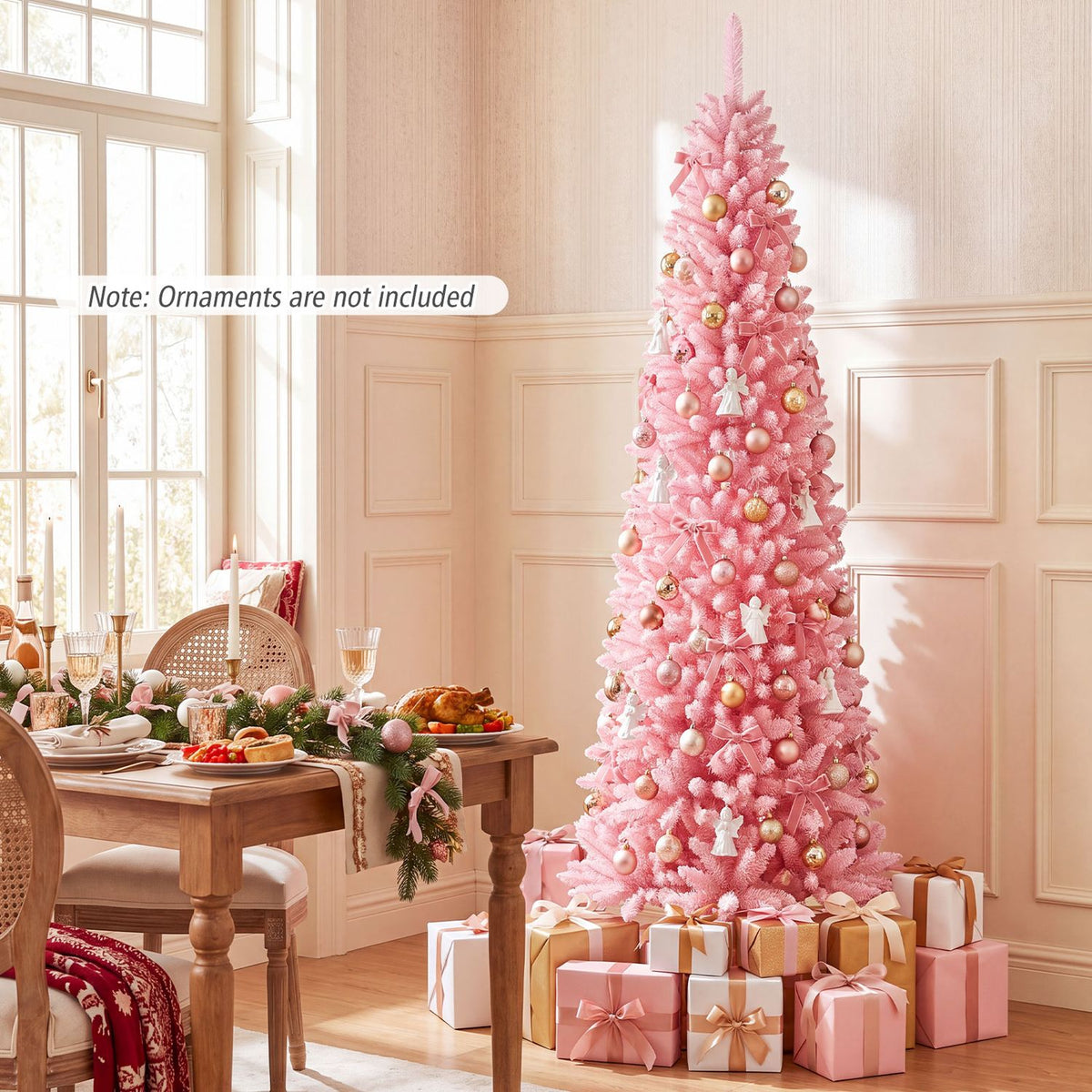 Decorated pink flocked Christmas tree beside a dining table in a sunlit room