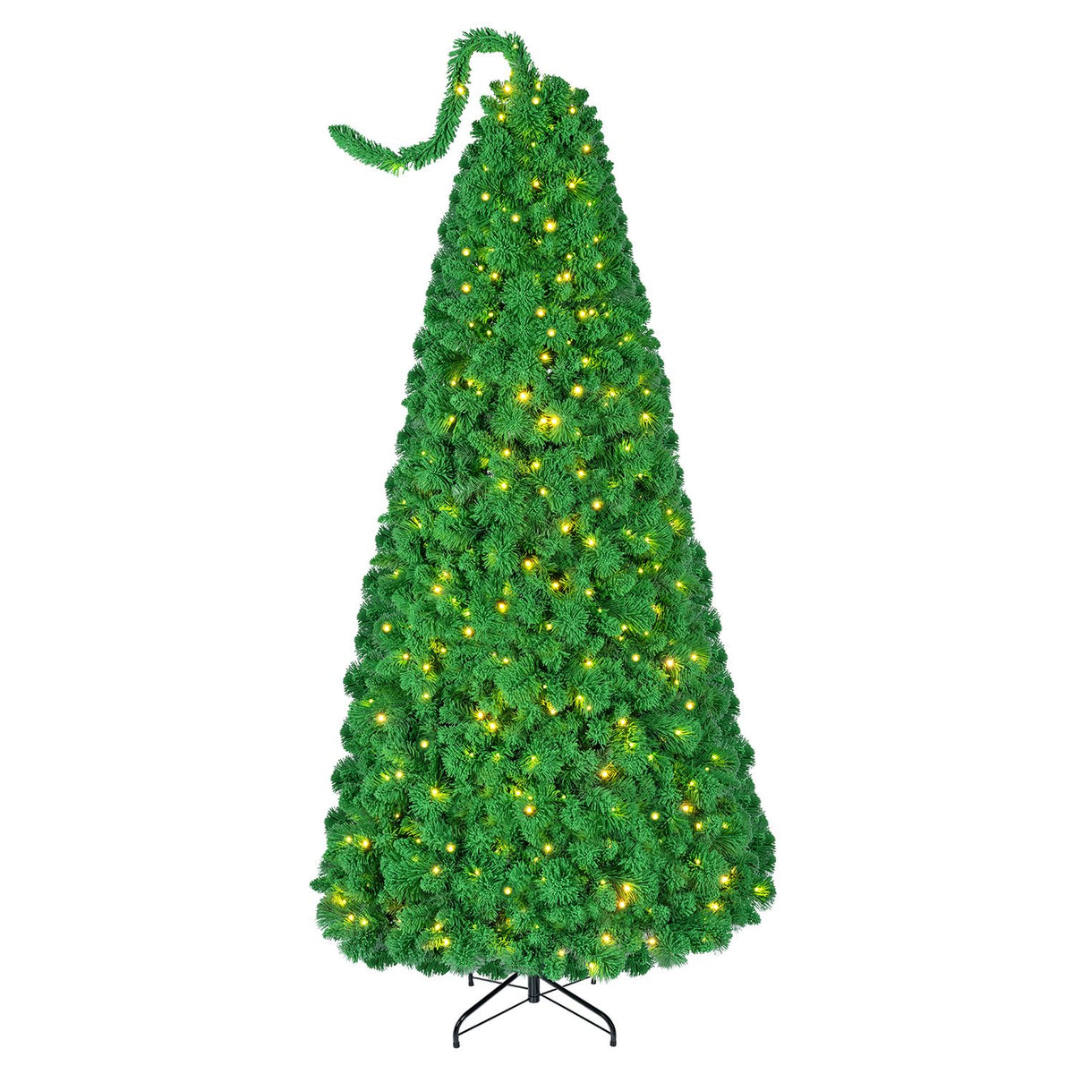 Lit green flocked Christmas tree with a curling top branch on a black metal stand against white.