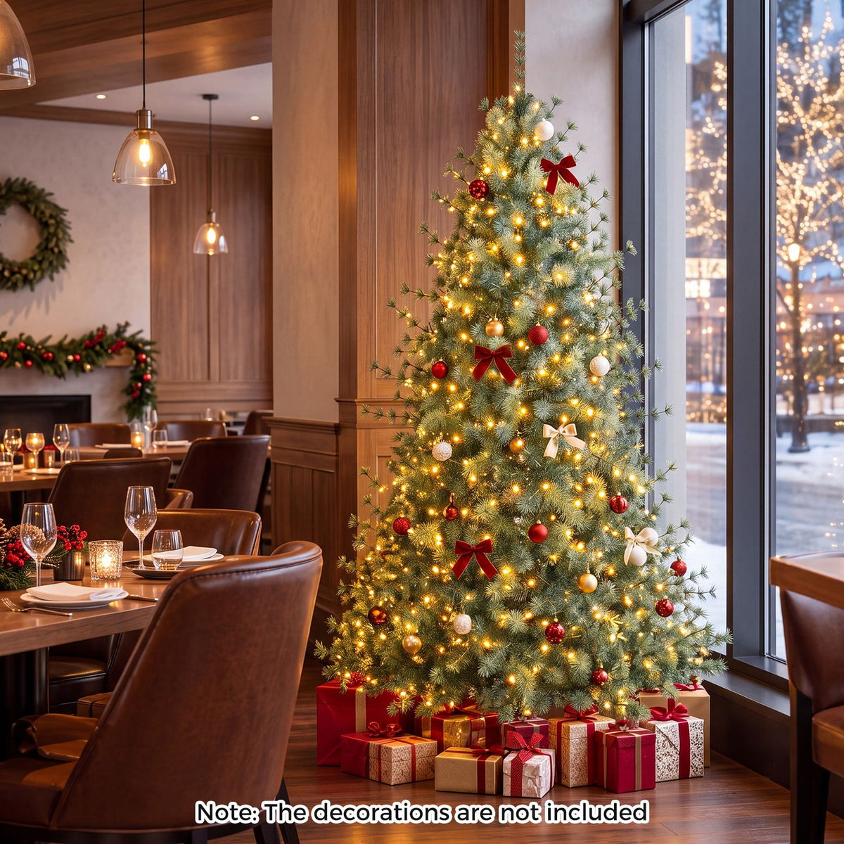 Decorated, glowing Christmas tree in a dining room, surrounded by wrapped gifts.