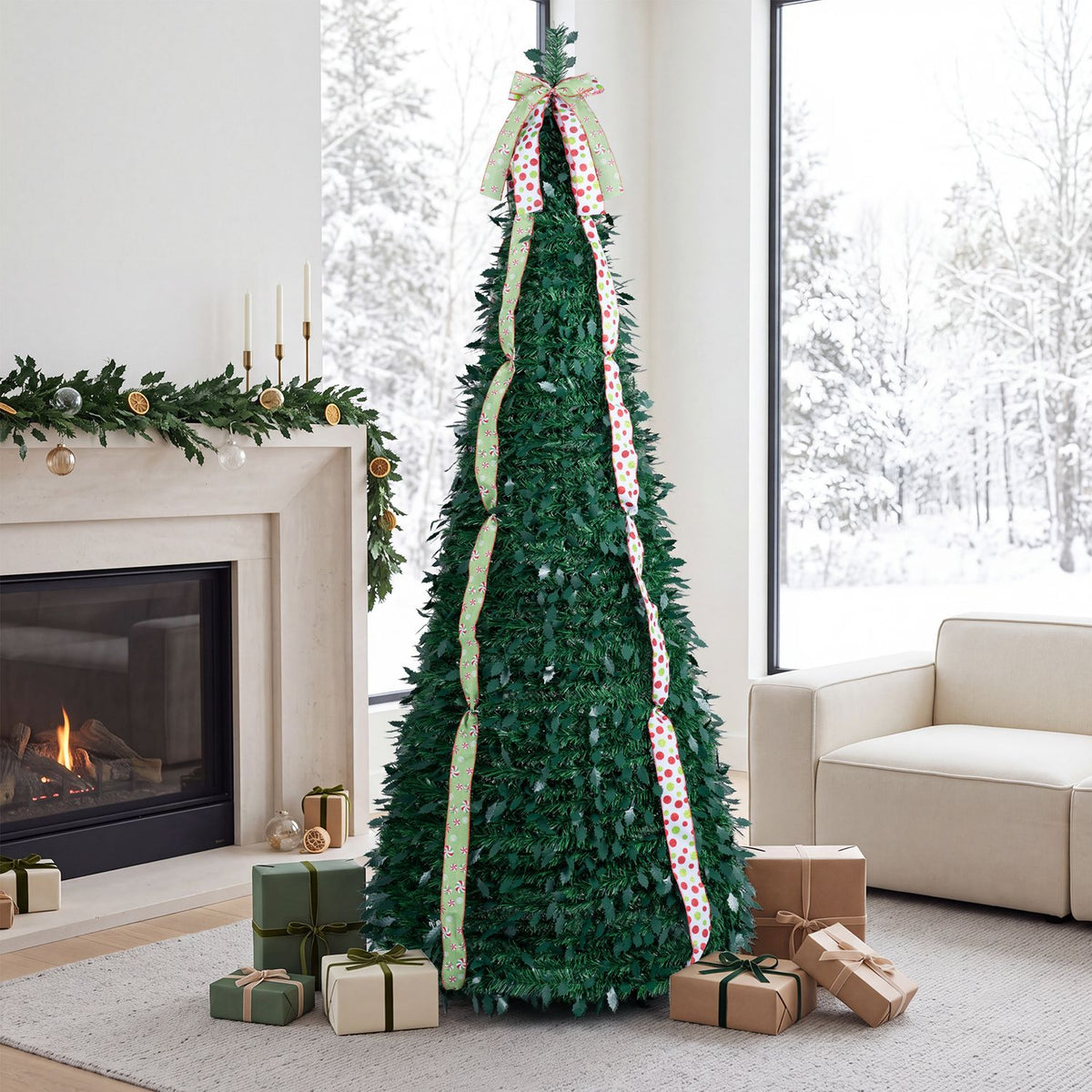 Green pop-up Christmas tree with patterned ribbons in a bright living room