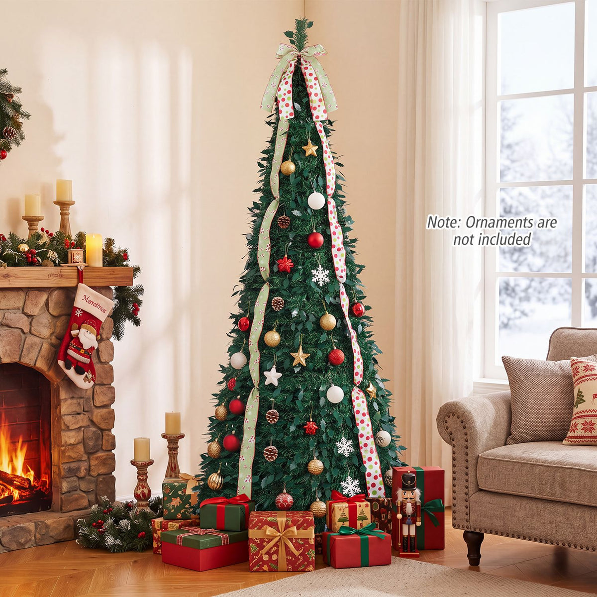 Ribbon-trimmed green Christmas tree decorated with ornaments beside a fireplace