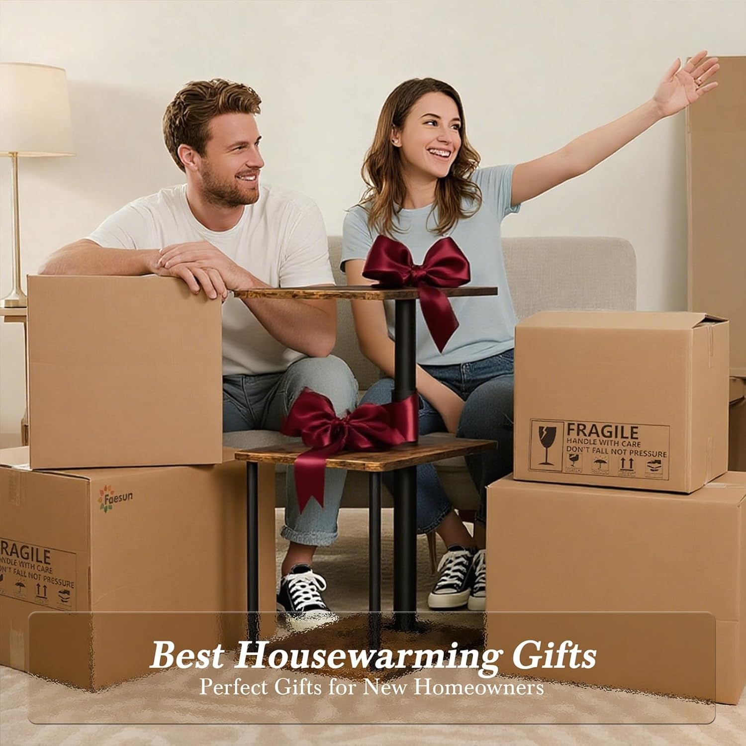 Smiling couple seated on a couch surrounded by moving boxes with the brown side table between them.