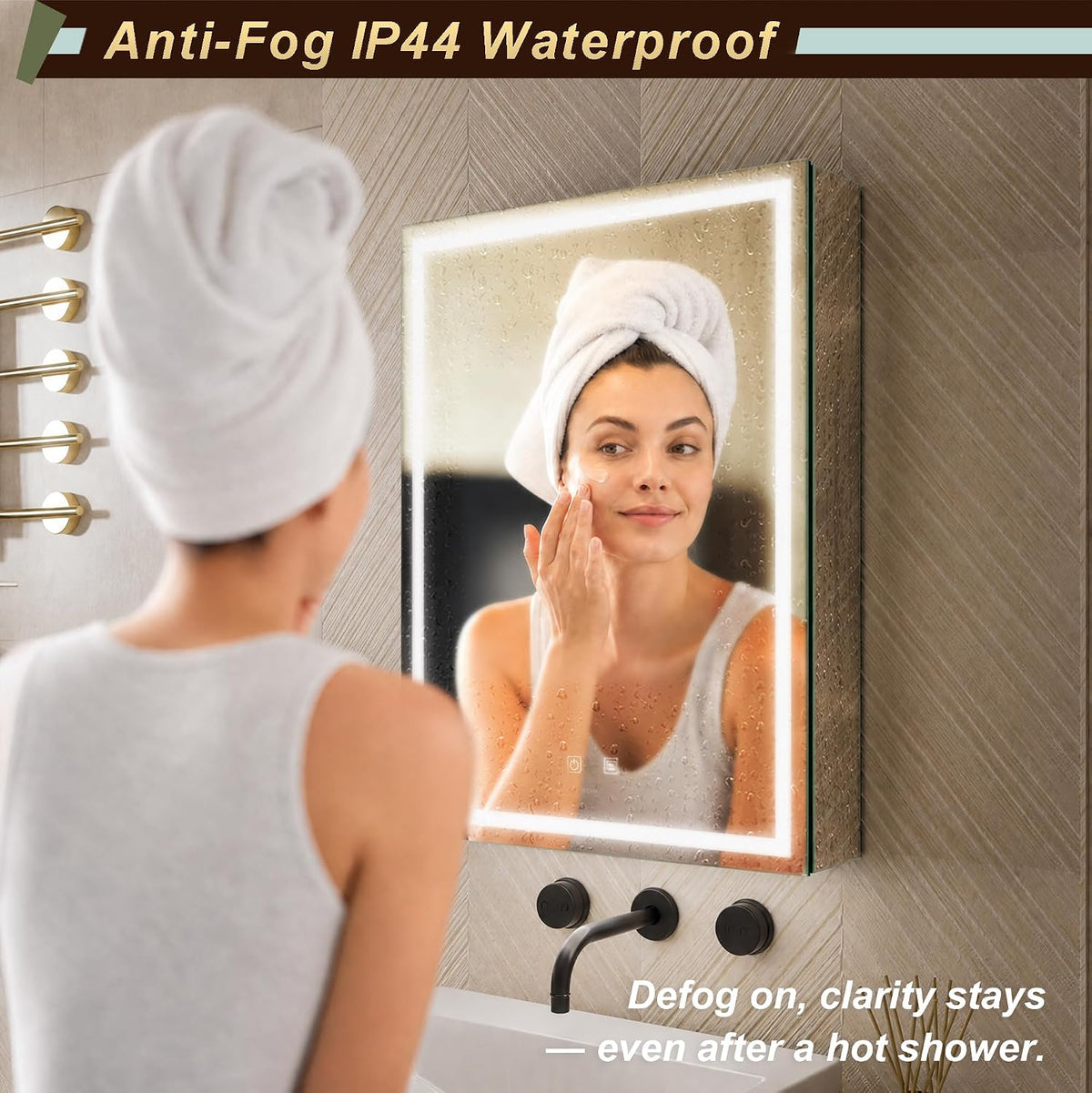 Woman with towel on her head touching her face while looking at a foggy, backlit rectangular mirror above a sink.
