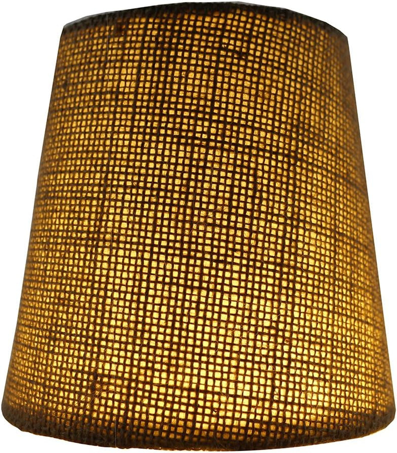Lit burlap chandelier shade illuminated from inside showing the woven grid pattern