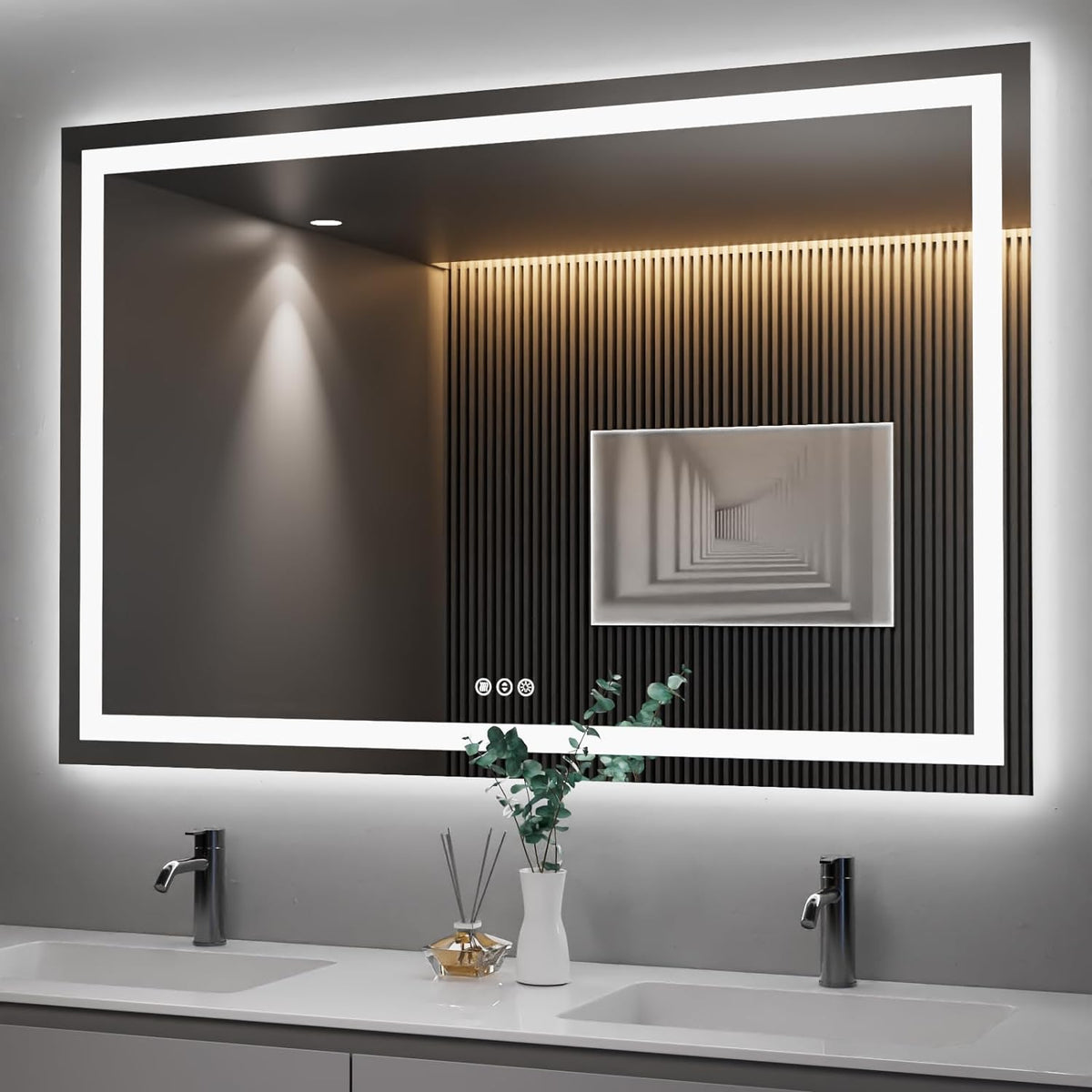 Wide illuminated mirror above double sink showing vertical wood slat wall reflection and small vase on countertop