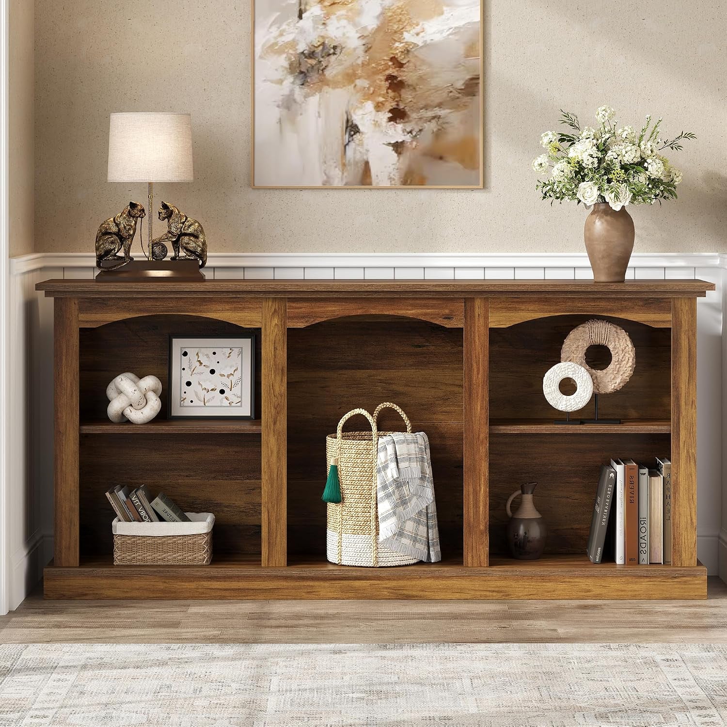 Straight front studio view showing three arched open compartments and a thick reinforced base in a rustic finish