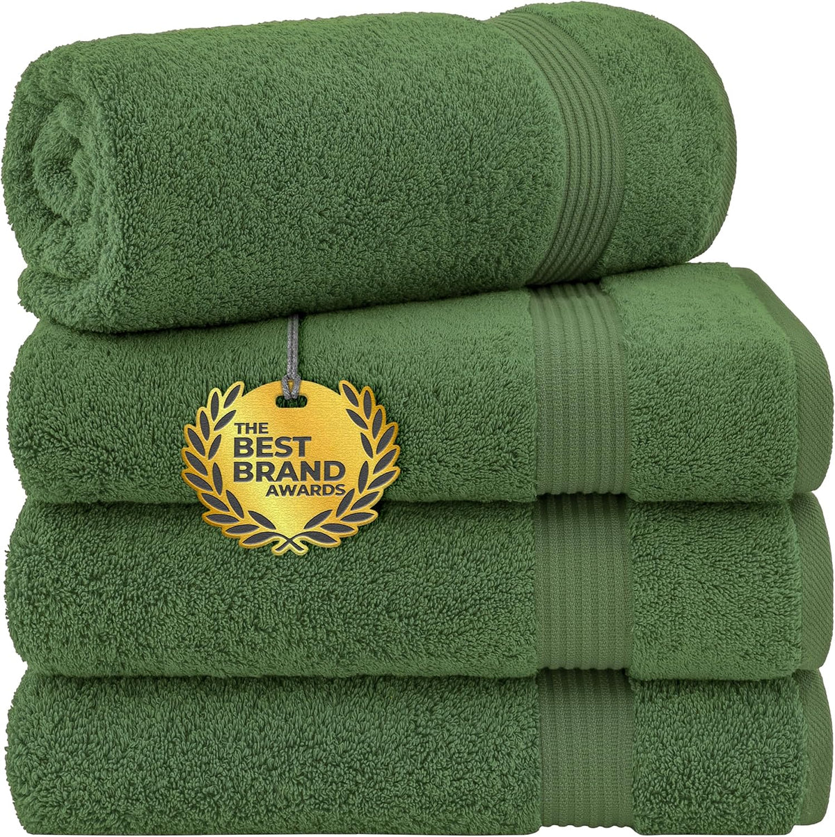 Three green bath towels stacked with the top towel rolled and a gold award tag attached to the middle towel